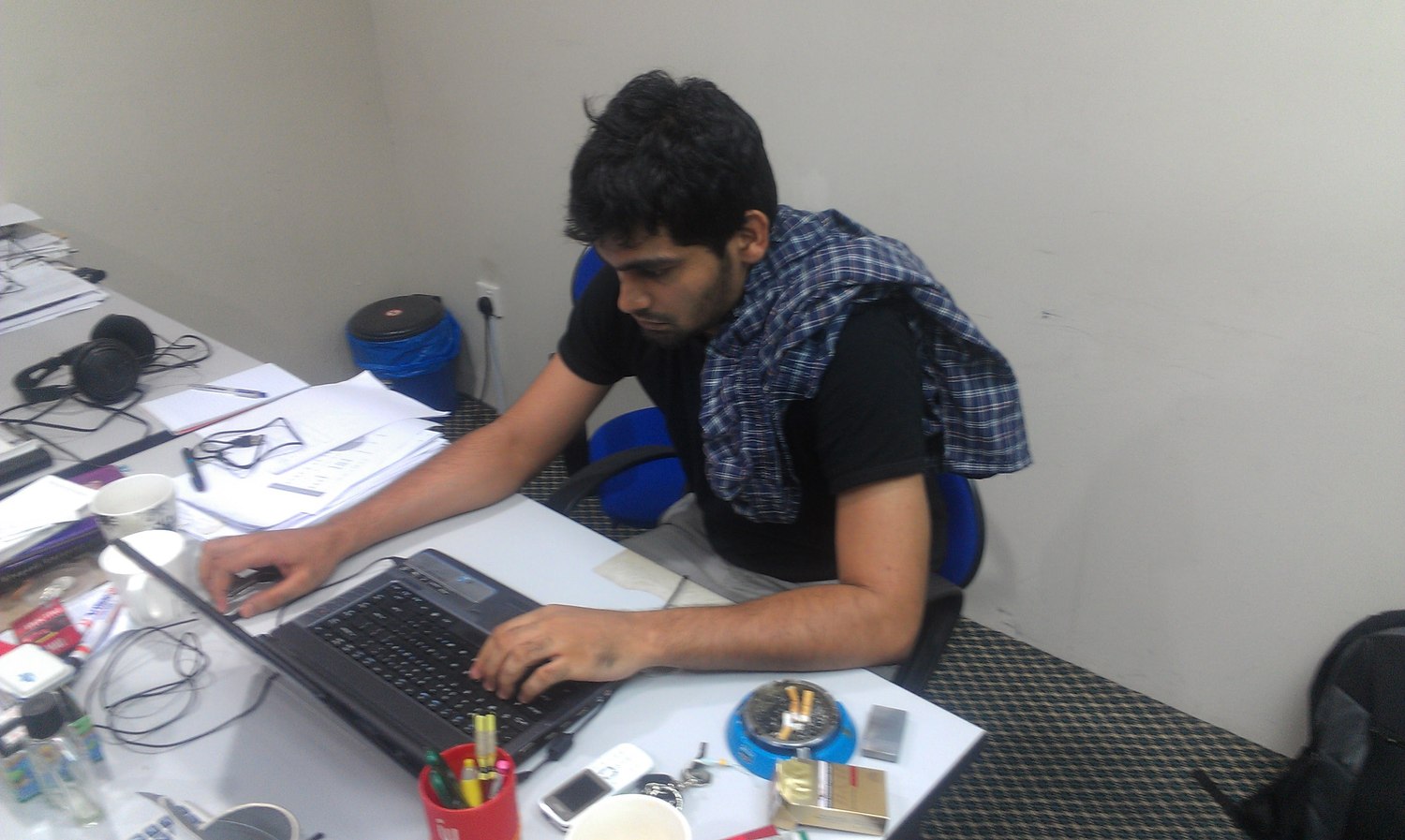 Naveed at his desk during the early Upwork freelancing years