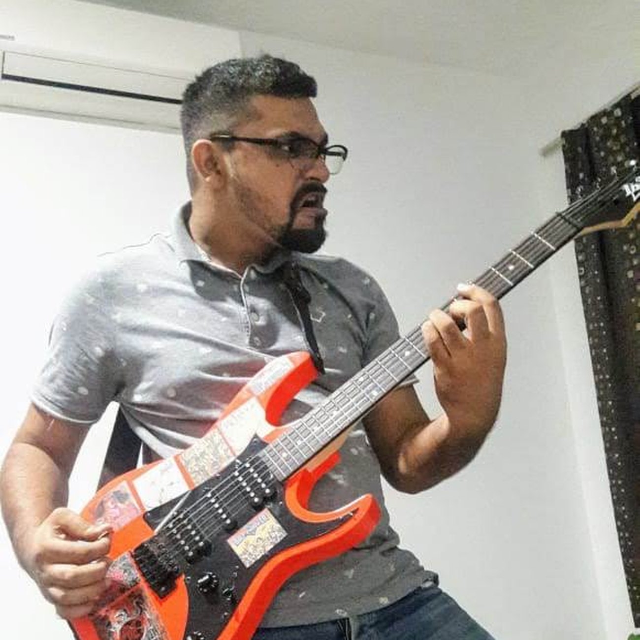 Naveed playing guitar