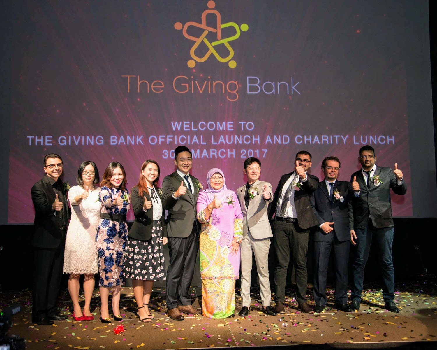 Naveed on stage at an event in Malaysia